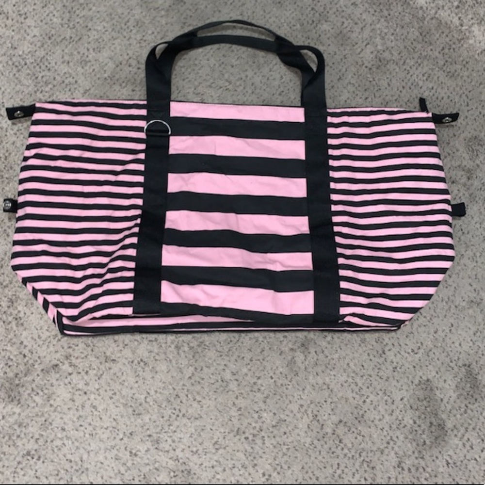 Large pink and black duffel bag